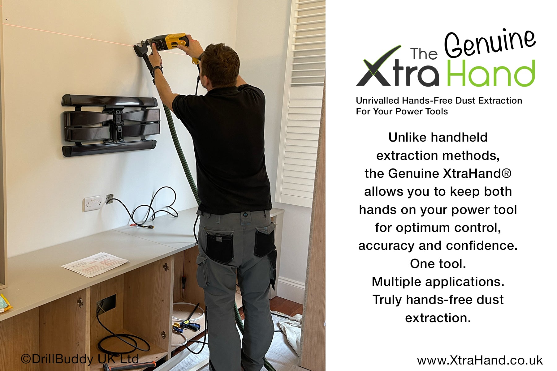 Installer using the Genuine XtraHand® hands-free dust extraction tool while drilling into a wall with both hands on the power drill. The XtraHand captures dust at source, improving control, accuracy, visibility and safety during installation work.