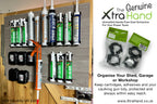 Genuine Mastic Clips® mounted on the inside of a shed door, securely storing silicone, mastic, caulk and adhesive cartridges alongside a loaded caulking gun. Includes two retail packs containing four pairs of Mastic Clips for organised workshop and shed storage.