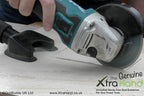 Using the Genuine XtraHand® hands-free dust extraction tool with a 125mm angle grinder to cut a ceramic tile aperture for a bathroom shaving socket. Captures tile dust at source to improve visibility, reduce airborne silica dust and keep the work area cleaner.