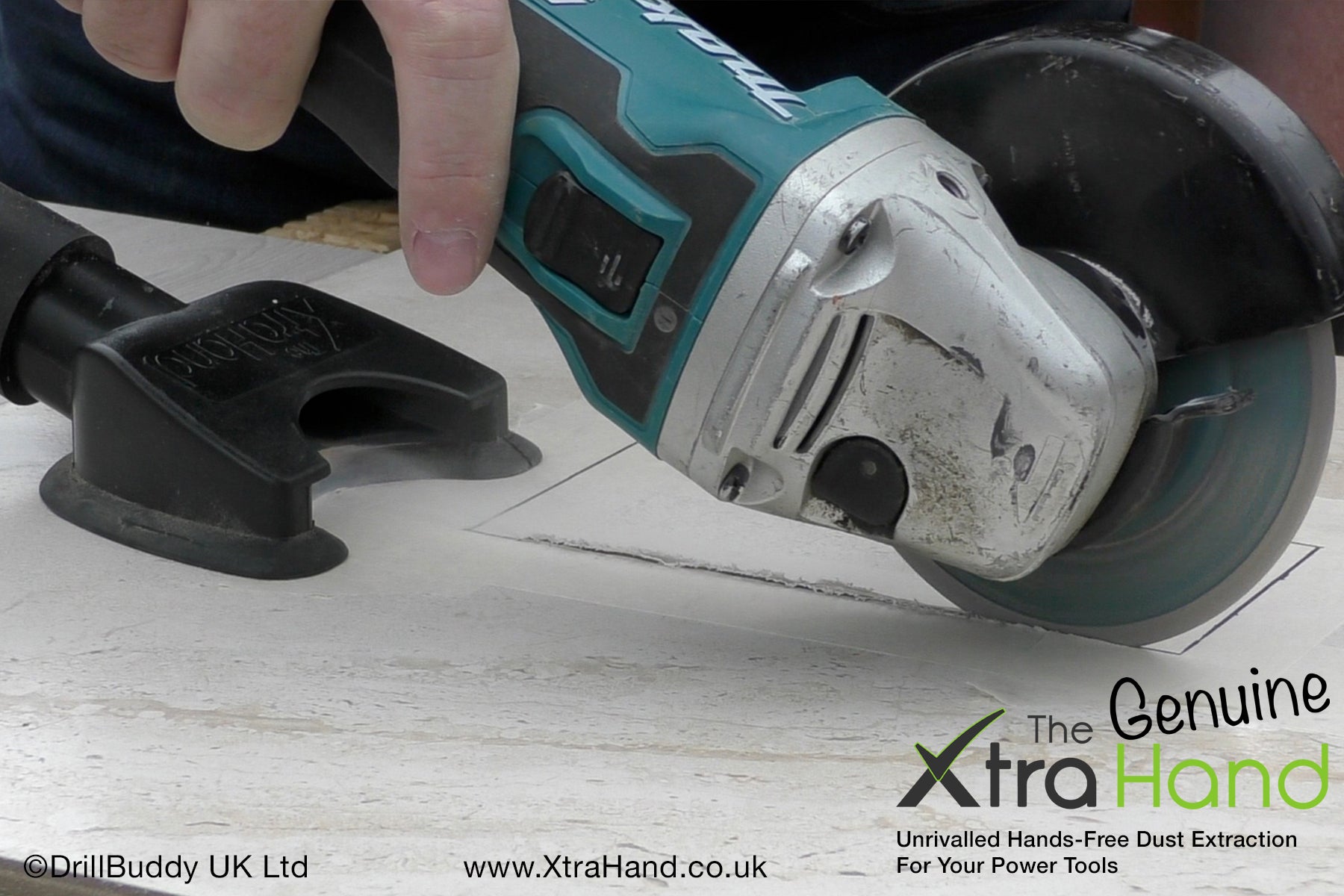Using the Genuine XtraHand® hands-free dust extraction tool with a 125mm angle grinder to cut a ceramic tile aperture for a bathroom shaving socket. Captures tile dust at source to improve visibility, reduce airborne silica dust and keep the work area cleaner.